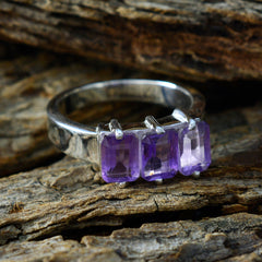 Nisa purple gemstone trilogy ring with three rectangular purple gemstones set in silver band