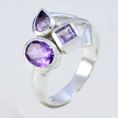 Saanvi purple gemstone trilogy ring with three distinct purple stones set in silver band