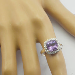 Priya purple halo gemstone ring with a square purple center stone and sparkling clear stones on band
