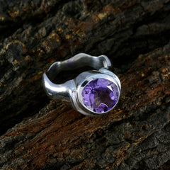 Penelope purple solitaire gemstone ring with round faceted purple stone set in silver band