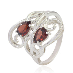 Cecilia red gemstone toi et moi ring with two pear-shaped red stones set in ornate silver band