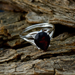 Soo-jin red solitaire gemstone ring with pear-shaped deep red stone set in silver band