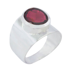 Florencia red solitaire gemstone ring with a silver wide band and oval red gemstone