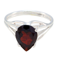 Soo-jin red solitaire gemstone ring with pear-shaped red stone set in silver band
