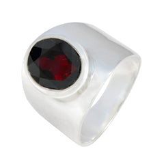 Florencia red solitaire gemstone ring with a bold silver band and deep red oval gemstone