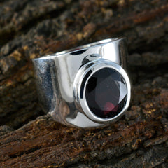Florencia red solitaire gemstone ring with a large round red stone set in a polished silver band