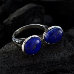 Lucy abstract blue gemstone ring with two oval stones set in silver band on dark background