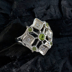 Liyana abstract green gemstone ring with silver geometric design and multiple green stones