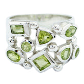 Camilla abstract green gemstone ring featuring various green stones set in silver band