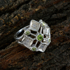 Liyana abstract green gemstone ring with multiple green stones and silver geometric design