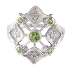 Liyana abstract green gemstone ring with intricate silver design and multiple green stones