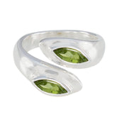 Lara silver ring featuring two green marquise stones in an abstract green toi et moi ring design