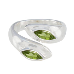 Lara silver ring featuring two green marquise stones in an abstract green toi et moi ring design