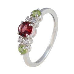 Meera abstract multicolor trilogy ring with red, green, and clear gemstones set in silver band