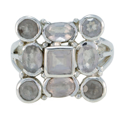 Hazel abstract pink navratna ring featuring multiple faceted gemstones in silver setting