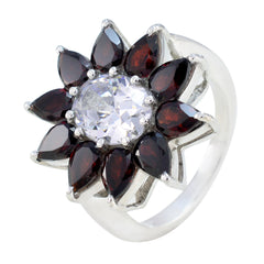 Ellie silver floral ring with central clear crystal and pear shaped deep red stones abstract red gemstone ring