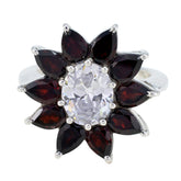 Ellie abstract red gemstone ring with silver band central oval clear stone and marquise red stones in floral arrangement