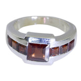 Bruna abstract red gemstone ring with square center stone and smaller red stones on silver band