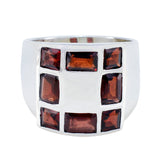 Elena abstract red gemstone ring with rectangular red stones set in a wide silver band