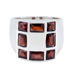 Elena abstract red gemstone ring with rectangular red stones set in a wide silver band