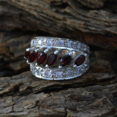 Katarina abstract red gemstone ring silver multi row band with marquise red stones and pave white stones on wood