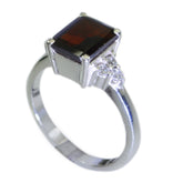 Liyana abstract red halo ring with square red gemstone and silver band with small clear stones