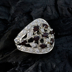 Rosa abstract red stone ring with silver setting and multiple red and white stones on black background