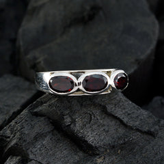 Saanvi abstract red trilogy ring with three deep red oval gemstones set in silver band