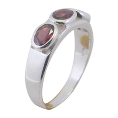 Saanvi abstract red trilogy ring with three red stones set in a polished silver band