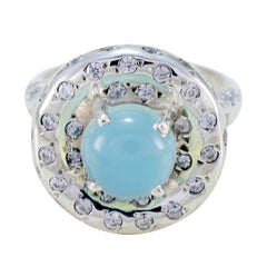 Lucia aqua gemstone statement ring with round blue cabochon center and sparkling cubic zirconia halo on silver band