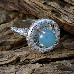 Lucia aqua gemstone statement ring with round aqua cabochon and halo of clear crystals on silver band