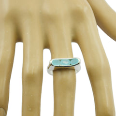 Lara aqua gemstone trilogy ring with three aqua blue stones on silver band worn on mannequin hand