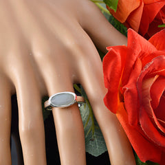 Seo-yeon aqua solitaire ring with oval aqua gemstone on silver band displayed on hand model