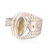 Camilla art deco yellow gemstone ring with zigzag pattern and oval yellow stone centerpiece