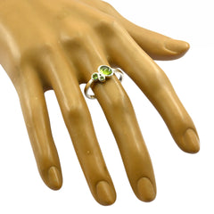 Riya artisan green gemstone ring with three polished green stones on silver band worn on hand