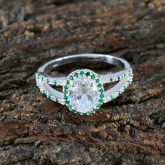 Joaquina artisan green halo ring featuring a sparkling oval center stone with green gemstone halo on silver band