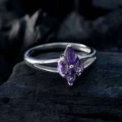 Layla artisan purple gemstone ring marquise cluster set in sterling silver band on dark textured stone