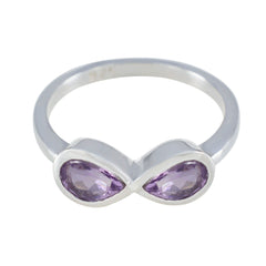 Haruka artisan purple gemstone ring with two pear-shaped purple stones set in silver infinity design