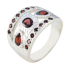Bianca artisan red gemstone ring with multiple red stones set in a wide silver band