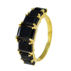 Skylar black gemstone engagement ring with gold band and rectangular black stones