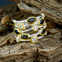 Isabella black gemstone statement ring with gold and silver accents featuring multiple black and clear stones