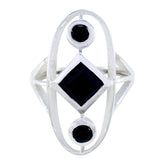 Lea black gemstone trilogy ring with two round and one square black gemstones set in silver band
