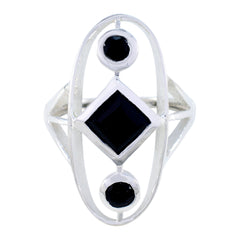 Lea black gemstone trilogy ring with two round and one square black gemstones set in silver band