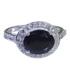 Violet black halo ring for women with a large black center stone and surrounding small clear stones