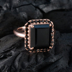 Chloe black halo ring for women with rectangular black stone and rose gold setting on dark background