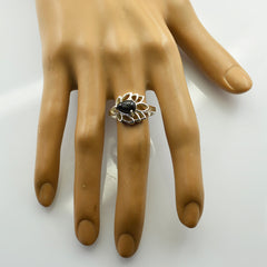 Sara black solitaire ring for women with teardrop stone and intricate silver floral design