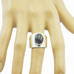 Dewi black solitaire ring for women with wide silver band showcasing a polished black stone