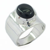 Dewi black solitaire ring for women with a polished silver band and oval black stone centerpiece