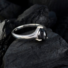 Naomi black solitaire ring with smooth black stone set on sleek silver band