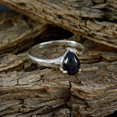 Naomi black solitaire ring with teardrop-shaped black stone set in polished silver band